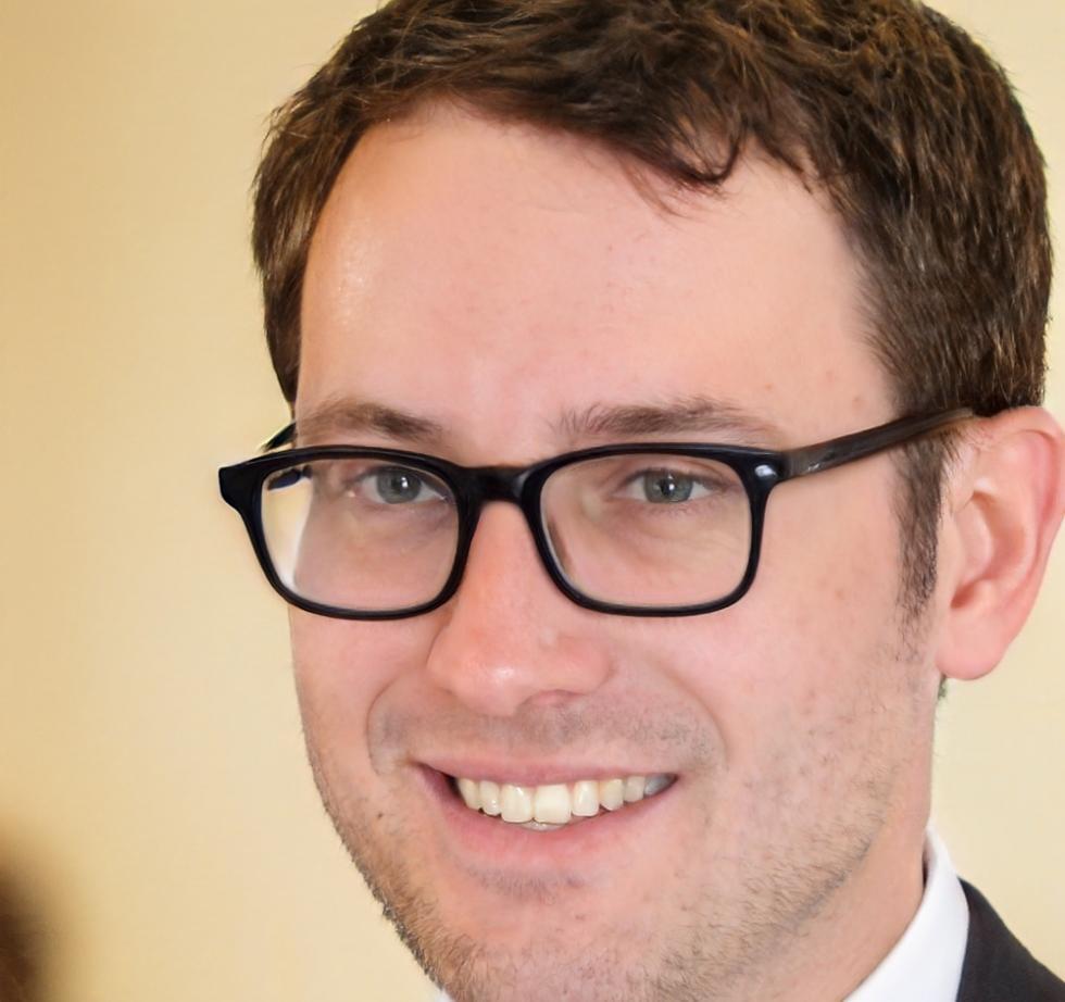 Professional headshot of Kieran Blackwell, Lead Game Designer at FroziaClub
